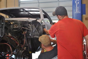 Students working on a car